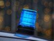 a blue light sitting on top of a car